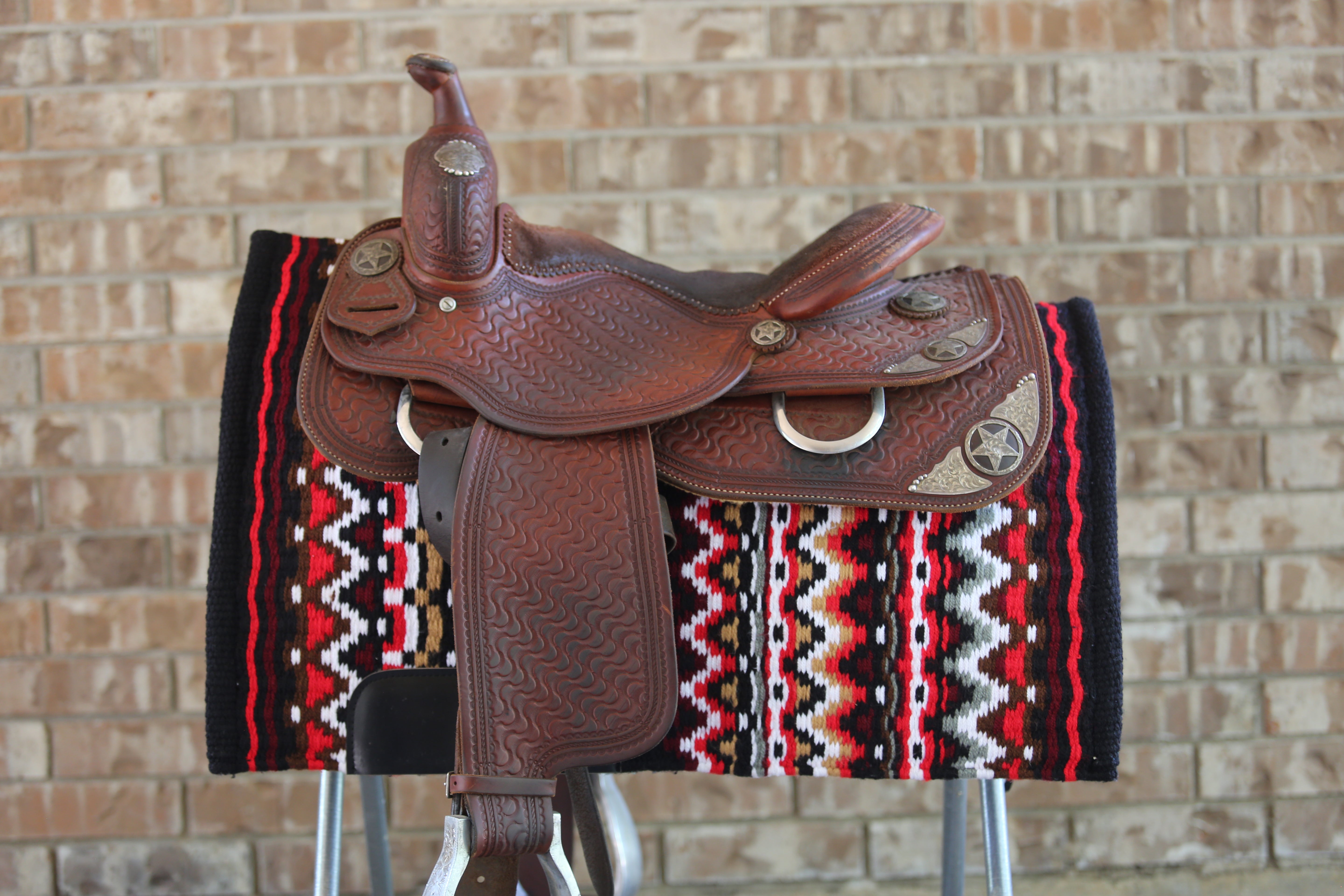 custom made western saddle pad with western saddle on top 