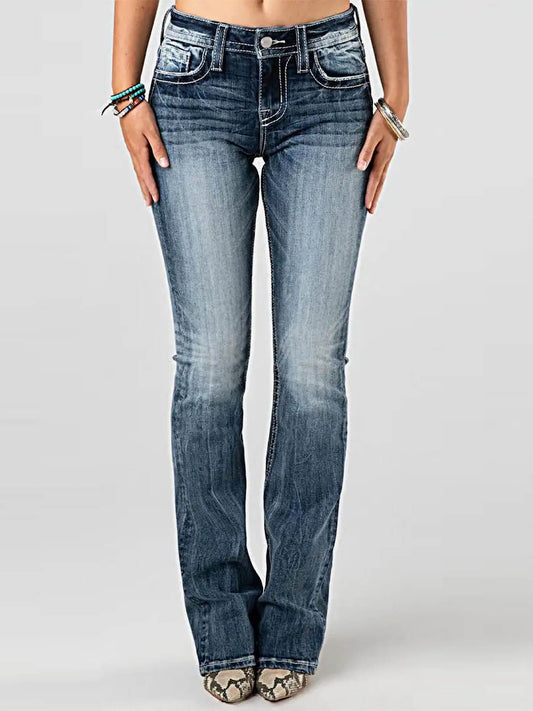 Blue jeans worn by a person on a white background