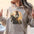 oversized custom hoodie with a custom vintage  watercolor cowgirl riding on her horse and sunset background graphic design